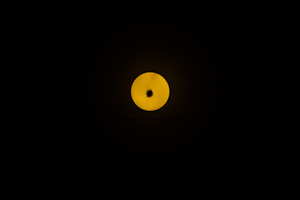 light fixture looks like moon against black background